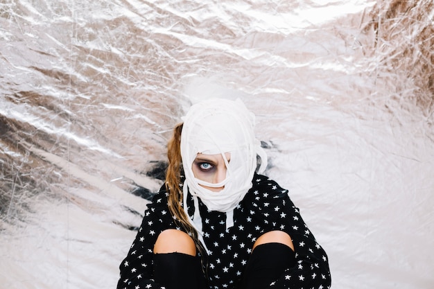 Free photo portrait of woman with bandaged face