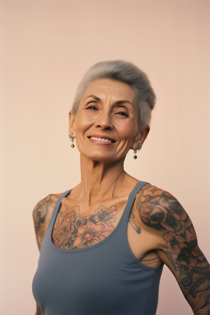 Free photo portrait of woman with body tattoos