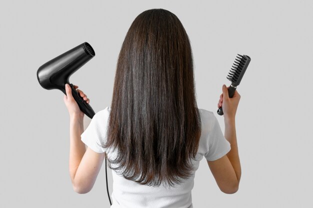 Portrait woman with brush and hairdryer