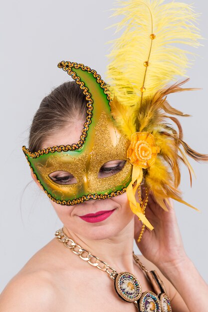 Portrait of woman with carnival mask