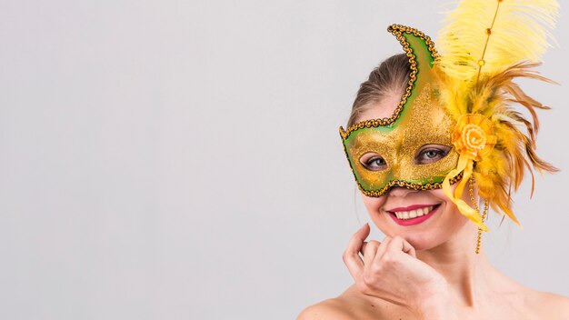 Portrait of woman with carnival mask