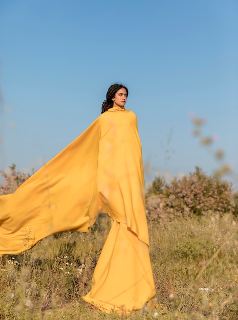 Free photo portrait of woman with cloth in the fields