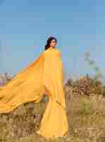 Free photo portrait of woman with cloth in the fields