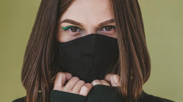 Portrait of woman with face mask and make-up