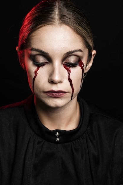 Portrait of woman with fake blood make-up