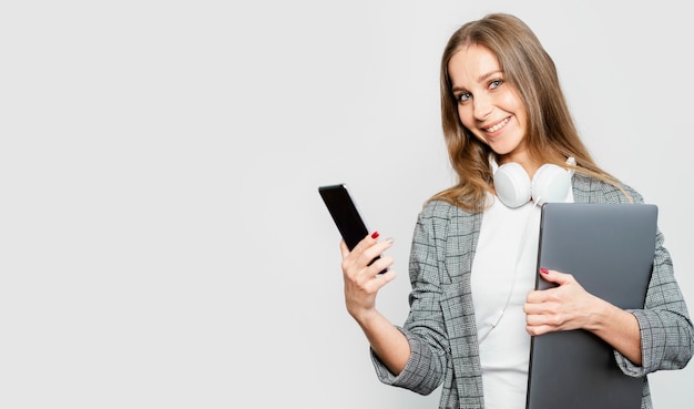 Portrait woman with laptop and mobile