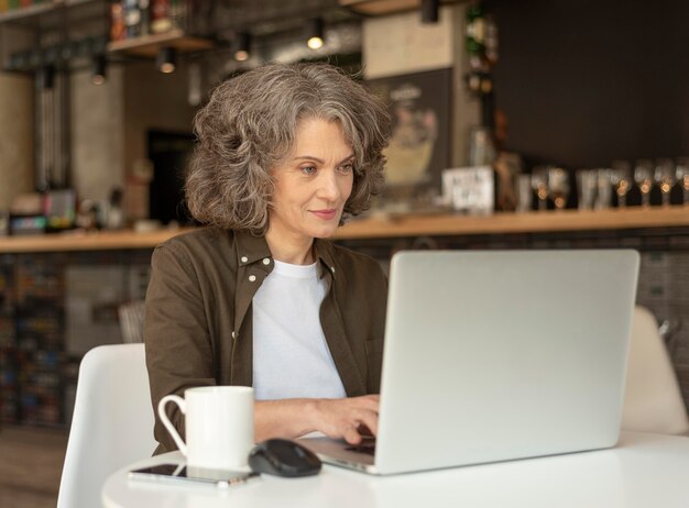 Portrait woman with laptop working