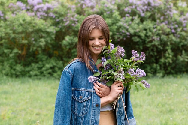 Portrait woman with lilac bouquet