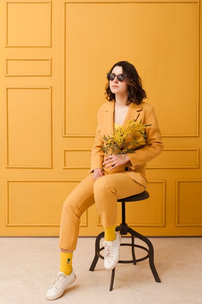 Portrait woman with sunglasses on chair