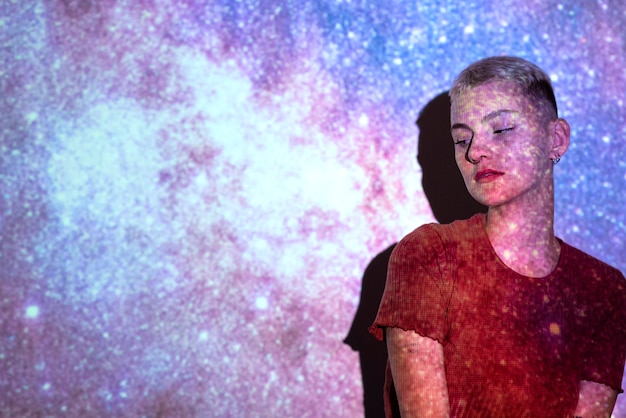 Portrait of woman with universe projection texture