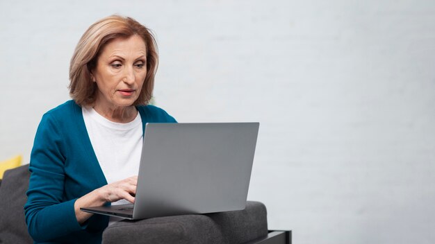 Portrait of woman working on a laptop