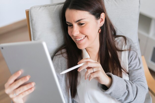 Portrait of woman working on tablet