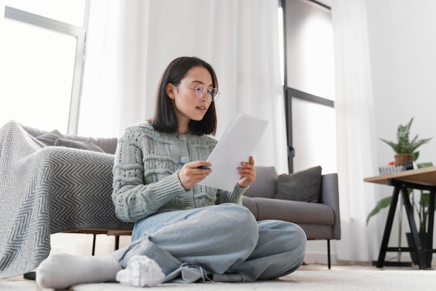 Free photo portrait woman writing letter