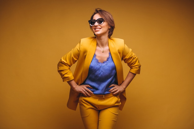 Portrait of woman in yellow suit isolated