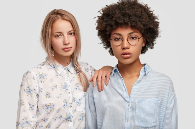 Portrait of women posing in shirts