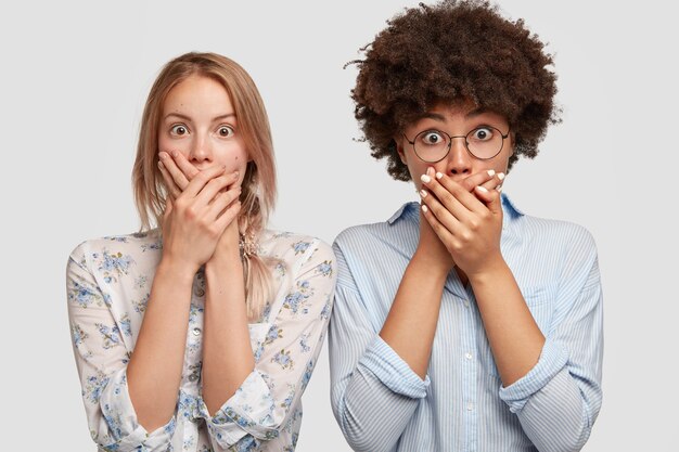 Portrait of women posing in shirts