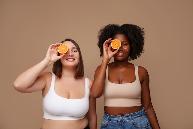 Free photo portrait of women with citrus for beauty