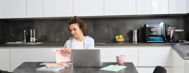 portrait-working-woman-home-checks-her-n