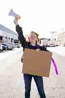 Free photo portrait of young activist protesting