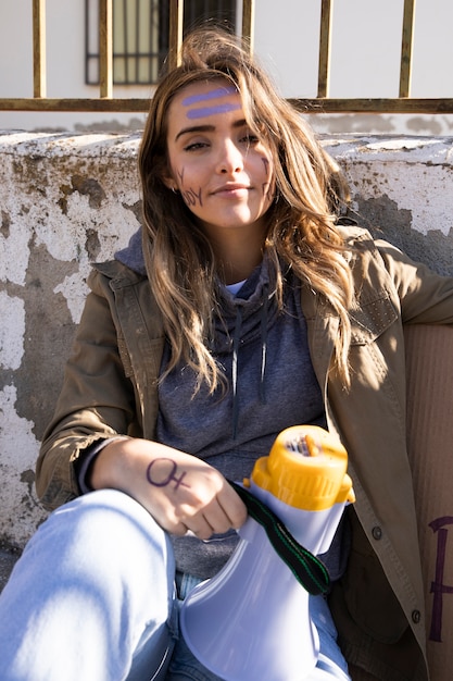 Free photo portrait of young activist protesting