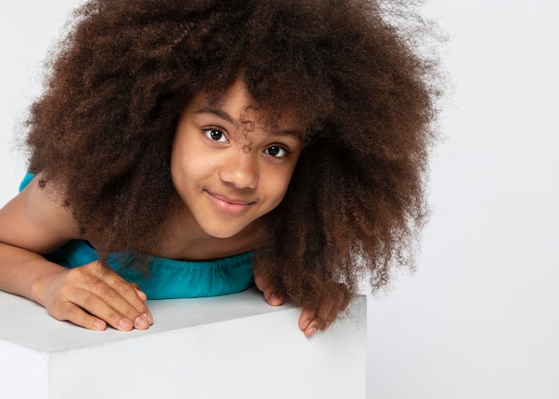 Portrait of young adorable girl posing in a cute top