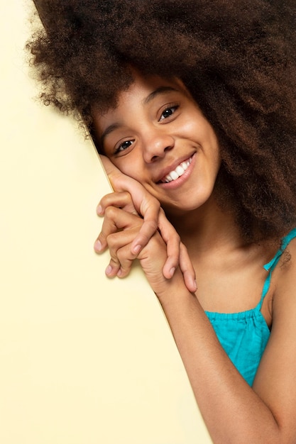 Free photo portrait of young adorable girl posing in a cute top