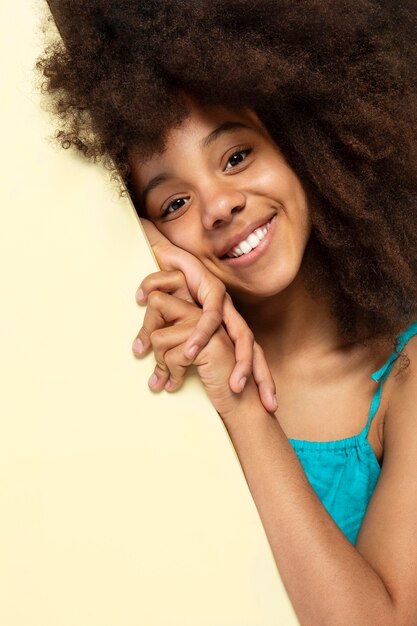 Portrait of young adorable girl posing in a cute top