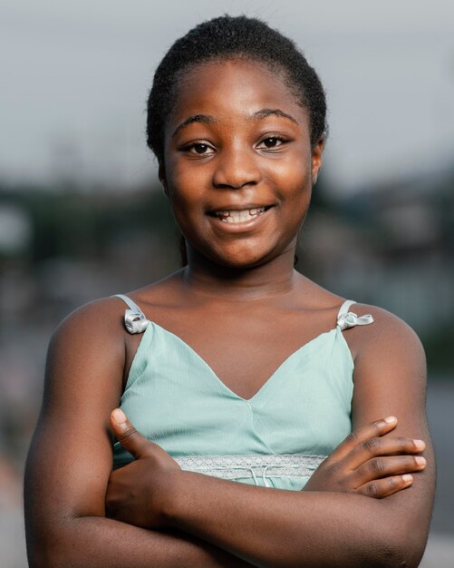 Portrait young african girl with arms crossed