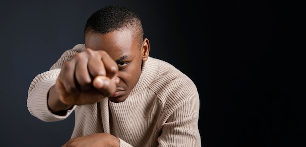 Portrait young african man with fist clenched