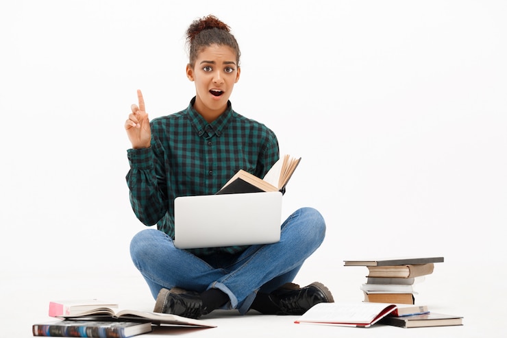 Free Photo portrait of young african woman with laptop on white