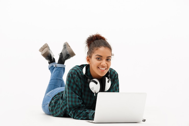 Free Photo portrait of young african woman with laptop on white