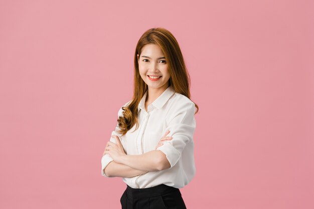 Portrait of young Asia lady with positive expression, arms crossed, smile broadly, dressed in casual clothing and looking at camera over pink background.