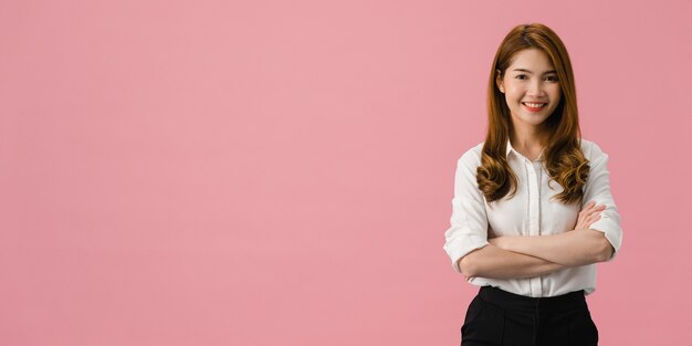 Portrait of young Asia lady with positive expression, arms crossed, smile broadly, dressed in casual clothing and looking at camera over pink background.