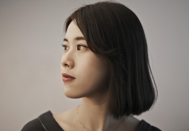 Free photo portrait of young asian woman in profile