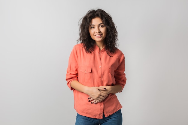 Portrait of young attractive confident woman in orange shirt