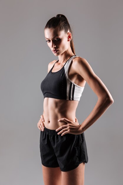 Portrait of a young attractive fitness woman posing