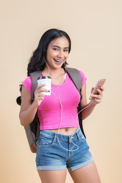 Portrait of a young attractive woman making selfie photo with smartphone