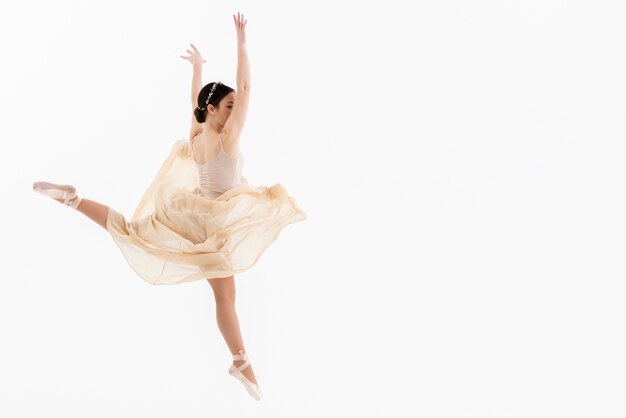 Portrait of young ballerina dancing