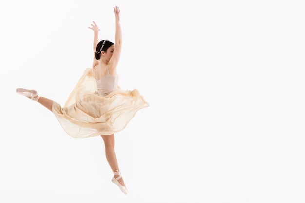 Portrait of young ballerina dancing