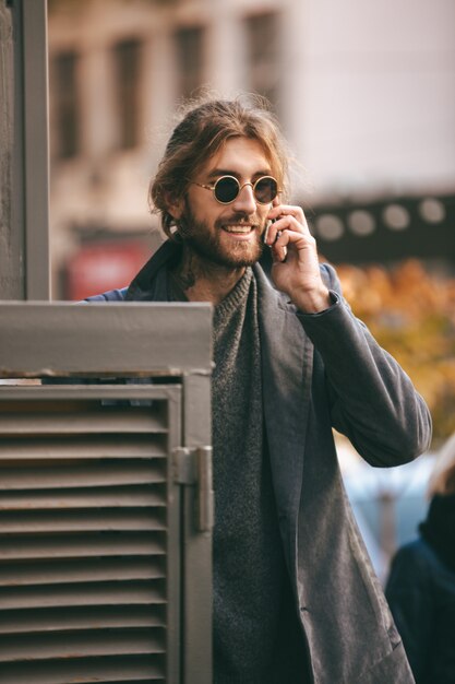 Portrait of a young bearded man in sunglasses