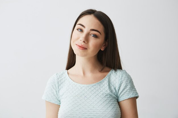 Portrait of young beautiful brunette girl smiling .