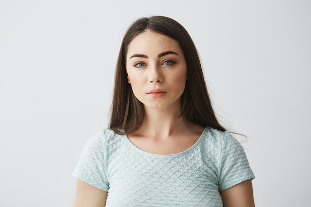 Portrait of young beautiful brunette girl .