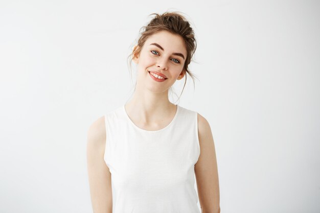 Portrait of young beautiful brunette woman smiling.