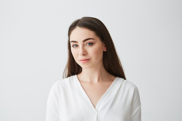 Portrait of young beautiful businesswoman smiling .