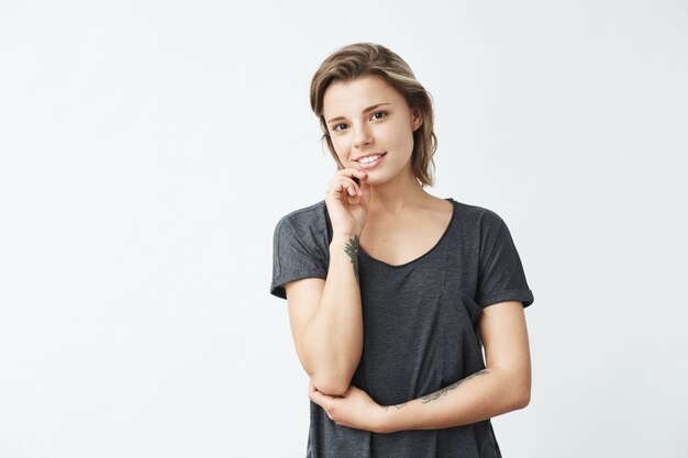 Portrait of young beautiful cute cheerful girl smiling .