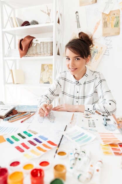 Portrait of a young beautiful fashion designer woman working