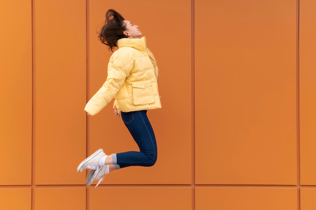 Free photo portrait young beautiful female jumping