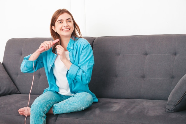 Portrait of young beautiful female in stylish clothes