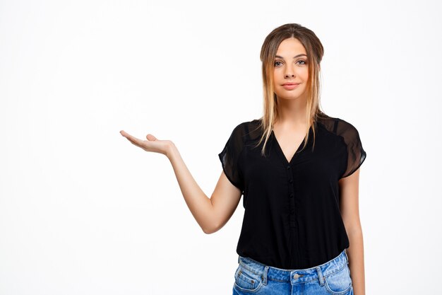 Portrait of young beautiful girl over white background. Copy space.