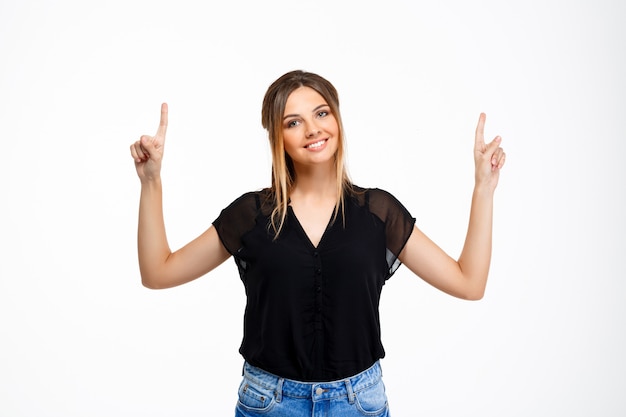 Portrait of young beautiful girl over white background. Copy space.